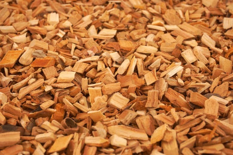 Bulk wood chips illustrating industrial biomass and landscaping uses across Europe